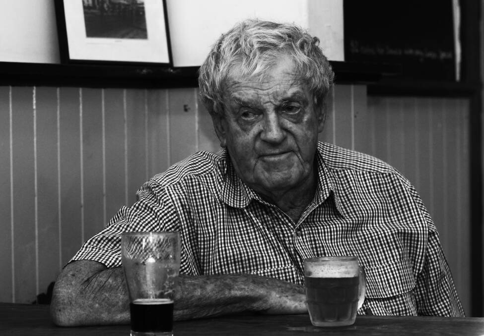 LARRIKIN: Peter 'Candles' Carroll enjoys a beer at Corowa's Newmarket Hotel, known as the Old Cocky's Pub.