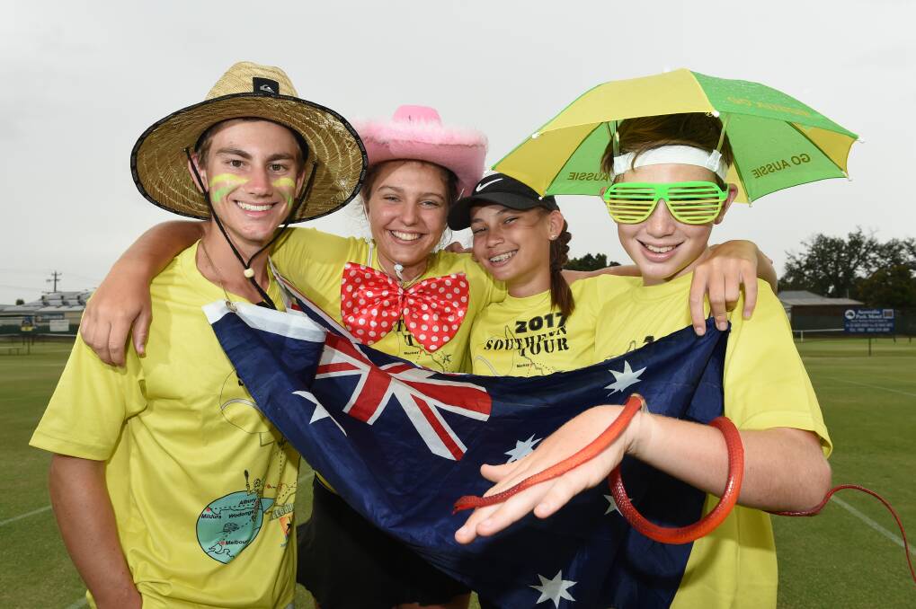 TEAM HUMOUR: Queensland's Joe Benzie, Teah Argent, Alana Flanagan and Etienne Horak with some of the funny awards given out at the end of each day. Picture: MARK JESSER