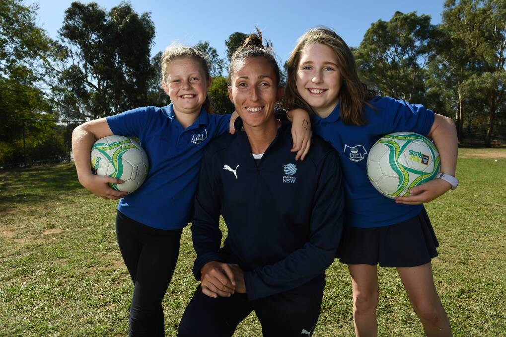 STAR: Sydney FC goalkeeper Trudy Burke with Thurgoona Public School students Isabellah Davis, 9, and Georgie Grant, 9. Picture: MARK JESSER