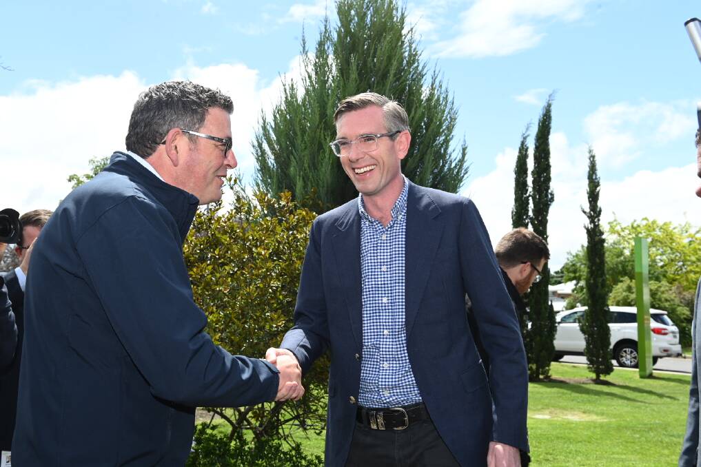 Victorian Premier Daniel Andrews greets his NSW counterpart Dominic Perrottet at Albury hospital on Thursday ahead of the announcement of a $558 million redevelopment. Picture by Mark Jesser