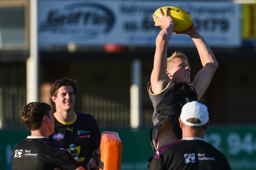 NICE HANDS: Wodonga's Kade Brown marks well above his head during training with the Murray Bushrangers. Pictures: MARK JESSER