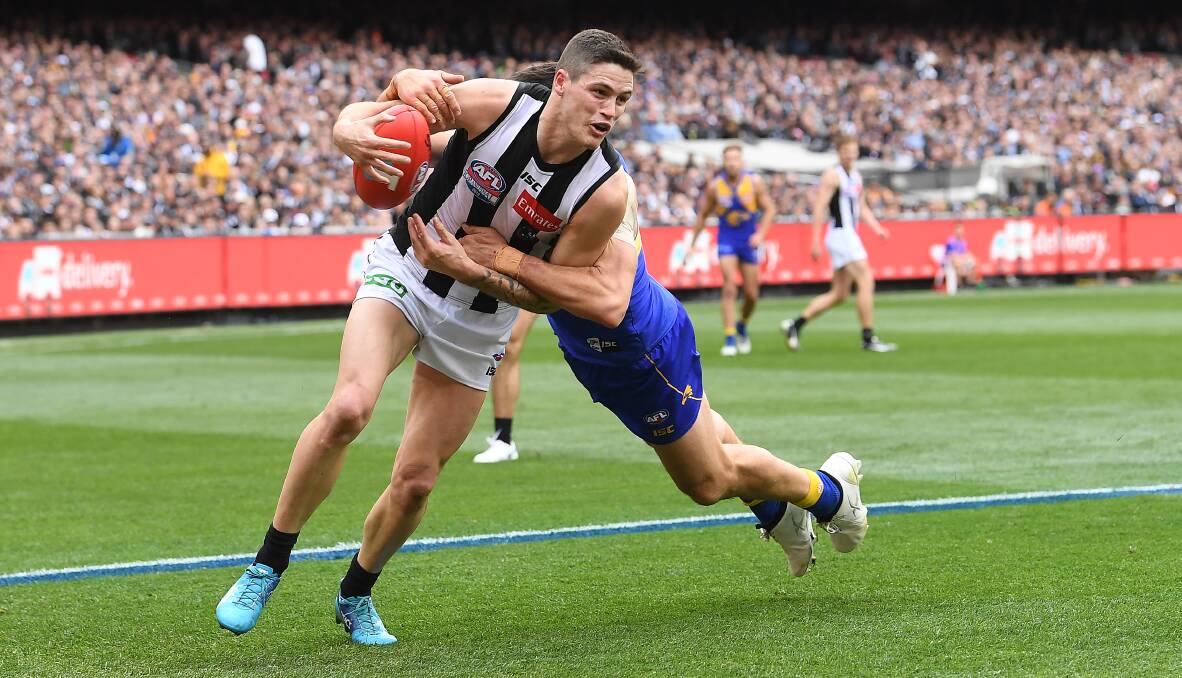 TOP YEAR: Collingwood's Jack Crisp is wrapped up in a tackle during the 2018 AFL grand final against West Coast. Picture: AAP IMAGE/JULIAN SMITH