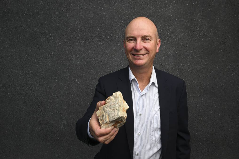 Kali Metals technical advisor Luke Mortimer holding a piece spodumene is from the mining company's Higginsville project in Western Australia. Picture by Mark Jesser
