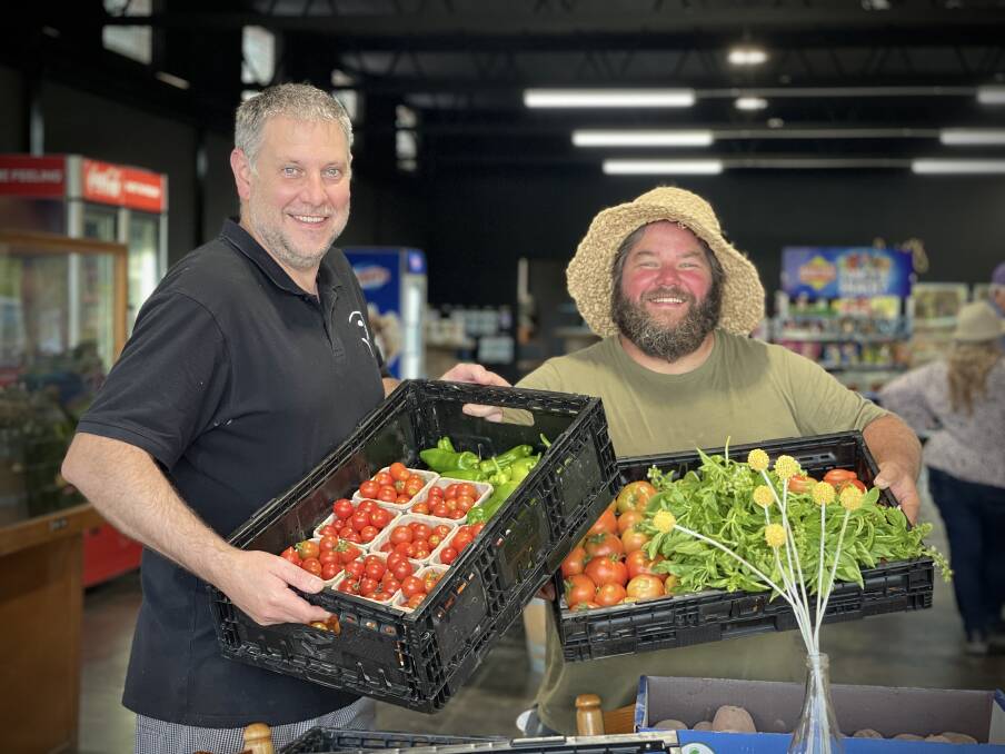 HONOURED: Acres and Acres Cooperative co-founder Josh Collings (right) with a long-time supporter, Pickled Parrot Providore Khancoban owner Cameron Harmer, is the Victorian Health Promotion Awards' Community Legend.