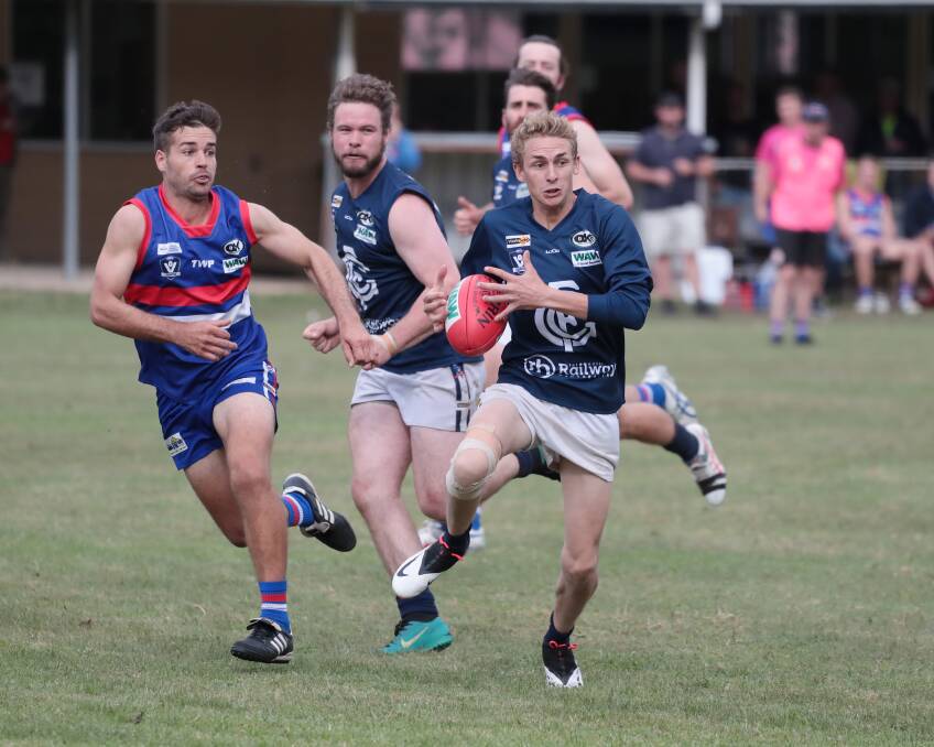 ON THE MOVE: Tom Webster booted two goals for Greta in the Blues' one-point loss to Tarrawingee last weekend. Picture: WANGARATTA CHRONICLE