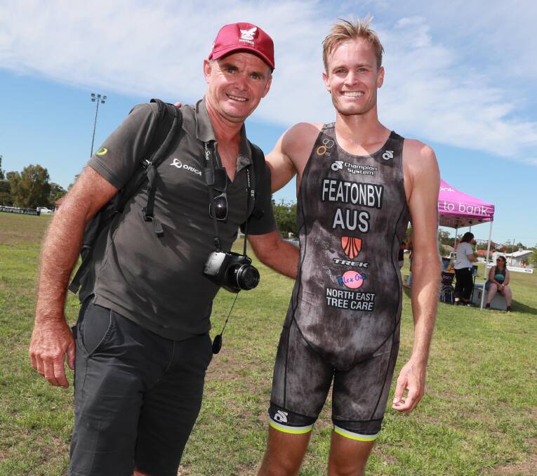 ALL SMILES: Greg Featonby celebrates with son Jesse after his win in the Ganmain Triathlon on Sunday. Picture: LES SMITH