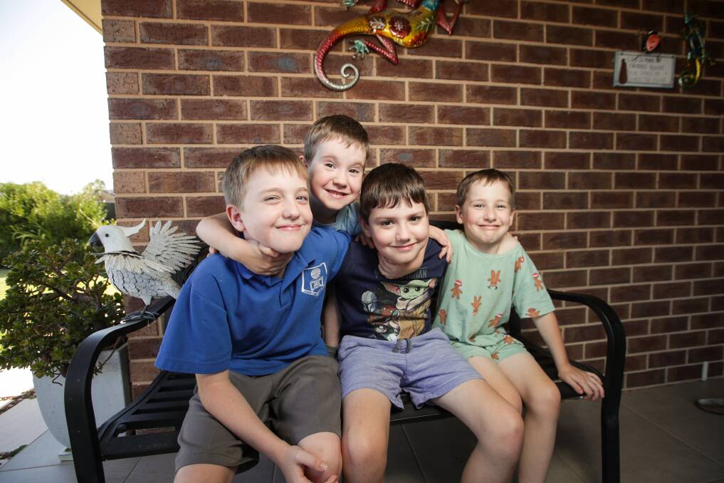 ON THE MEND: Ryley Hewson (middle), 9, with brothers Liam, 10, Casey 5, and Flynn 7, at home after his emergency surgery. Picture: JAMES WILTSHIRE