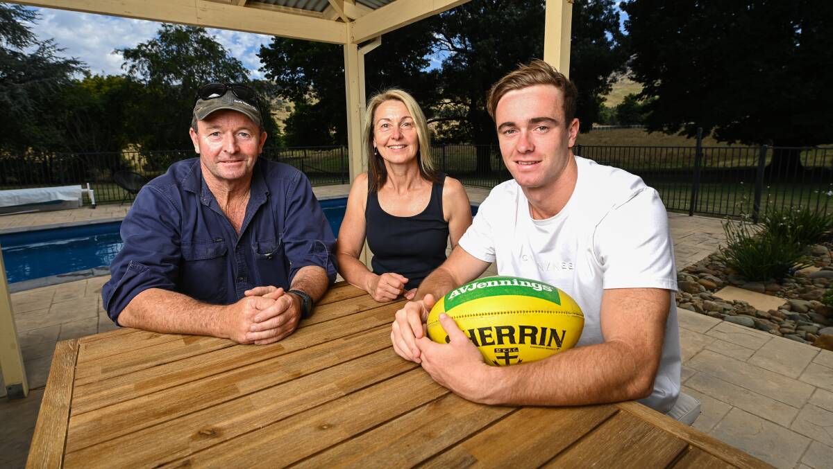 TOUGH BREAK: Ben Paton, with parents Steve and Julieanne at their home in Tallangatta South during the Christmas break, was eager to build on a strong 2020 season with St Kilda before an injury setback on Thursday. Picture: MARK JESSER