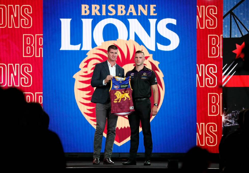 HUGE HONOUR: Yarrawonga's Ely Smith was presented his jumper by Brisbane legend Jonathan Brown during round one of the AFL draft on Thursday. Picture: AFL PHOTOS