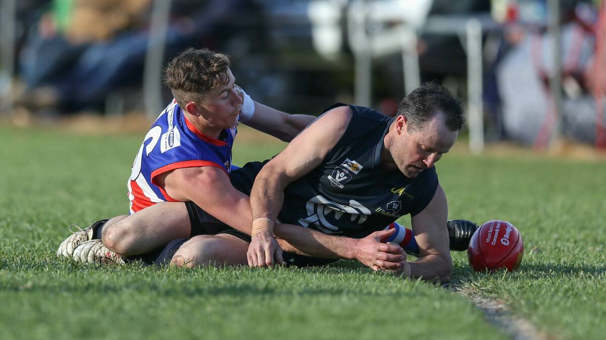 WRAPPED UP: Bullioh's Kieran Salome brings Cudgewa's Greg Wheeler to ground during this year's Upper Murray grand final at Cudgewa. The competition will continue on with six teams in 2020 with double-headers a possibility. 