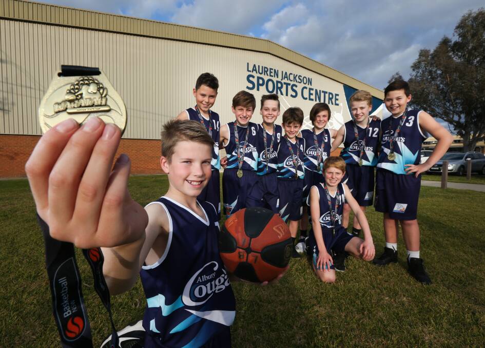 THAT'S GOLD: Albury Cougars' under 12 boys basketball team featuring Oliver Mack, 10, Flynn Scott, 11, Christian Moncrienff, 11, Sonny Junck, 11, Sonny Hynes, 11, Cooper Hall, 10, Harry Dean, 10, Zach Graham, 11, and Toby Scott, 11, took out the State Cup in Sydney on the weekend. Picture: KYLIE ESLER