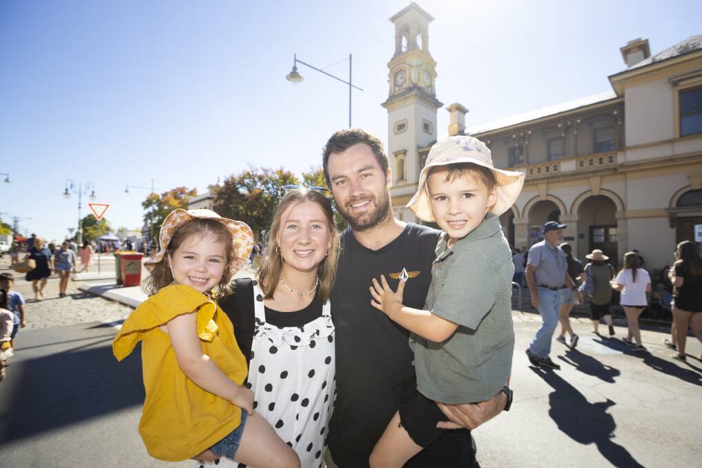 FUN FOR THE FAMILY: Kinzlie Buis, 3, Bec Strachan, Josh Buis and Zhanda Buis, 5, of Melbourne, enjoy the sunshine at Beechworth's Golden Horseshoes Festival on Easter Saturday. Picture: ASH SMITH