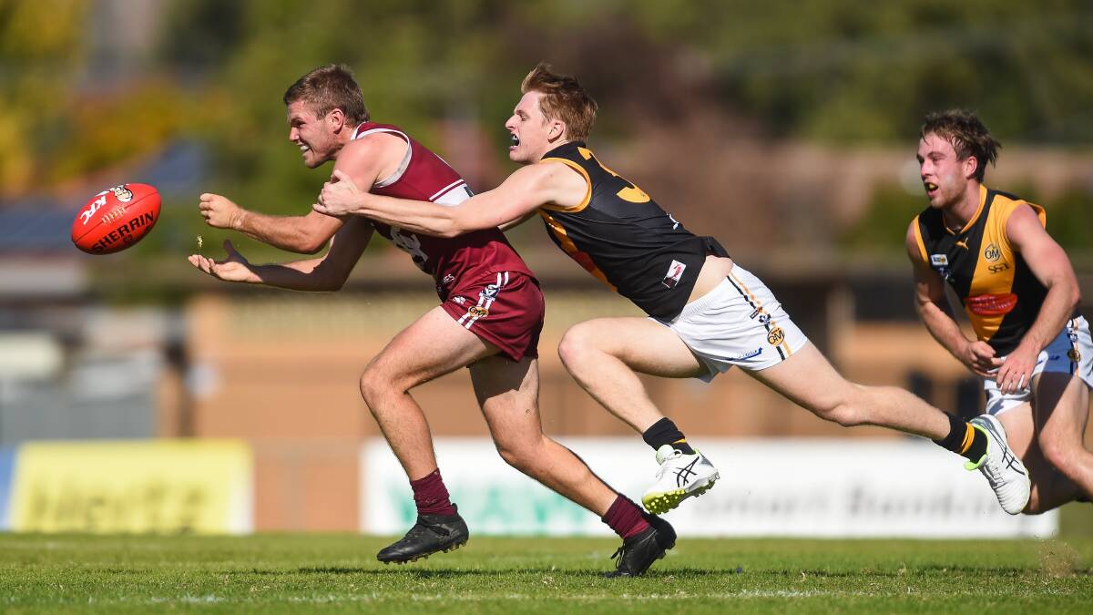 WRAPPED UP: Albury's Fraser Duryea lays a tackle on Wodonga's Reed Jackson this season. Duryea is one of four Tigers selected in the under-19 Ovens and Murray squad to take on Mornington Peninsula.