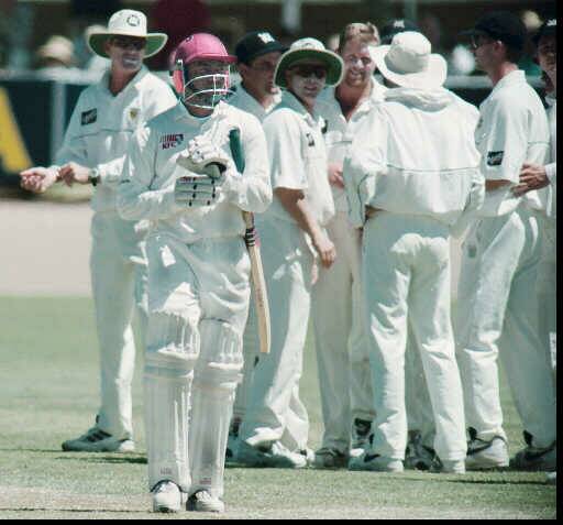 BIG WICKET: Jones (far left) and his Victorian teammates celebrate the dismissal of West Indian star Brian Lara during a tour match at Wangaratta in 1996.