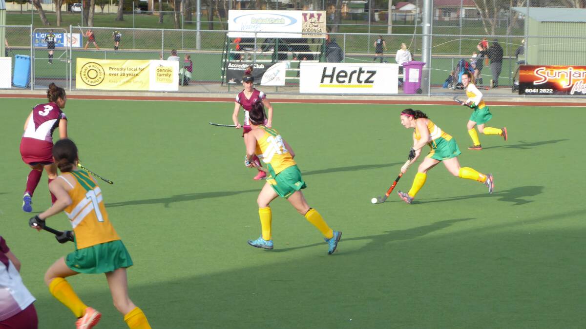 ON THE MOVE: Spitfires captain Sam Daly looks for an option as she streams through the middle of the field against Tuggeranong at Albury Hockey Centre.