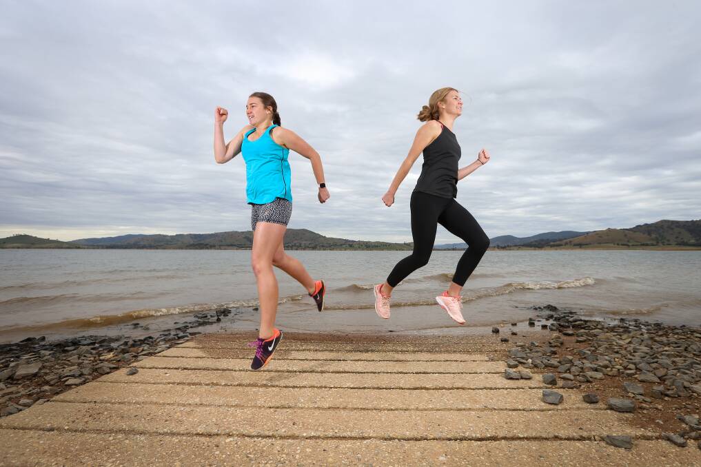 READY TO RUN: Sisters Olivia and Charlotte Lamb, aged 17 and 14, will contest the Kiewa-Tangambalanga Lions Club Milk Run at Huon Reserve on Sunday. It's the ninth edition after it was cancelled in 2020. Picture: JAMES WILTSHIRE