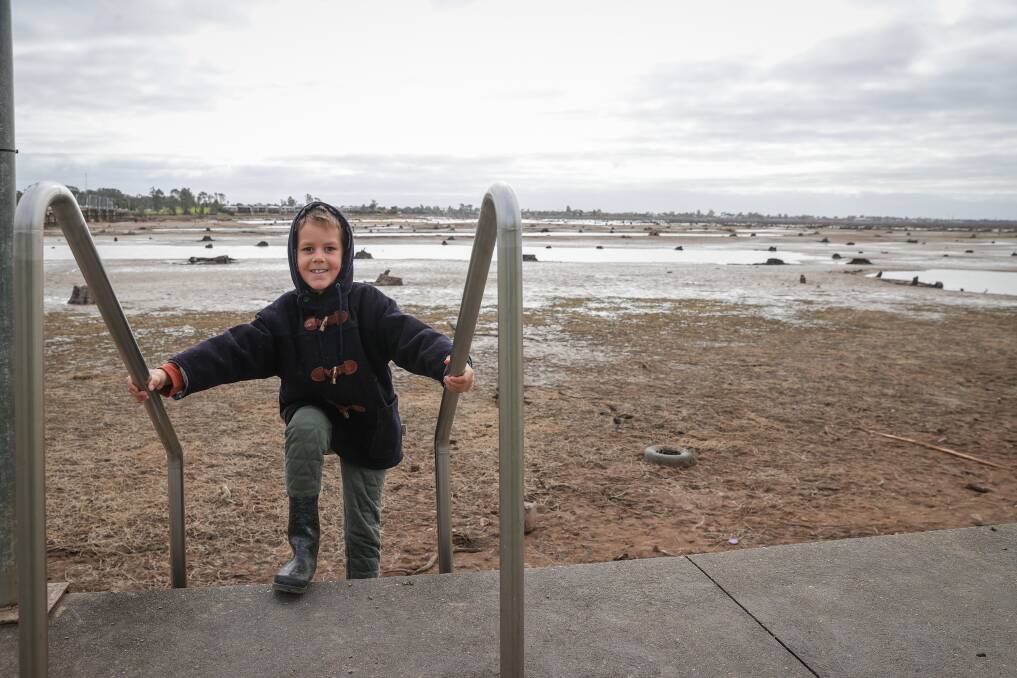 WIDE OPEN SPACE: Yarrawonga's Lachlan Frith, 7, lapped up the opportunity to explore an empty Lake Mulwala on Saturday. Picture: JAMES WILTSHIRE