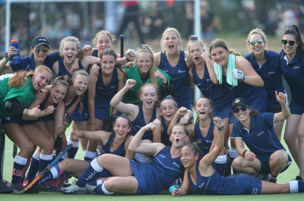 The Victorian under-15s celebrate their gold medal victory.