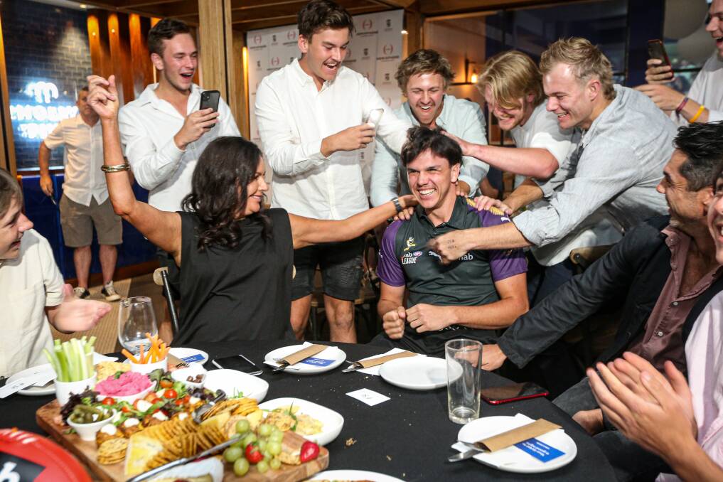 MOMENTOUS: Elijah Hollands is swamped by friends and family after he was selected by the Gold Coast Suns at last year's AFL draft. His journey to the draft has been captured in an AFL documentary. Picture: JAMES WILTSHIRE