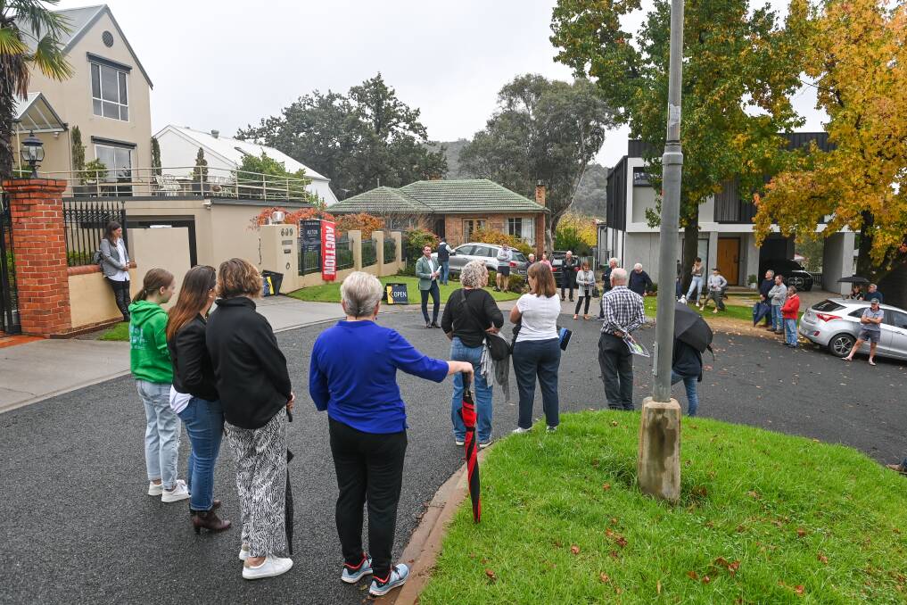KEEN INTEREST: The auction of 609 Read Place in Albury attracted a big gathering of onlookers on Saturday morning, but the property was passed in by agent Lachlan Hutchings after it failed to attract a bid. Picture: MARK JESSER