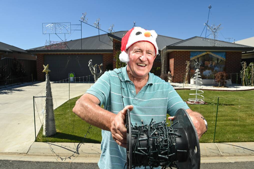 IN THE SPIRIT: Kevin Allitt's Thurgoona home has even more Christmas lights than last year, with all funds raised from the display to be donated to the Albury Wodonga Regional Cancer Centre. Picture: MARK JESSER
