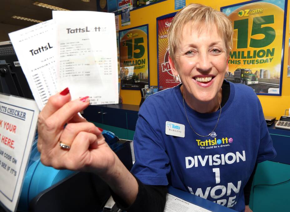 FLASHBACK: Marlene Smedley with a copy of the ticket and the payout slip of a division one Tattslotto syndicate winner worth $1.4 million at her West Wodonga store in 2009.