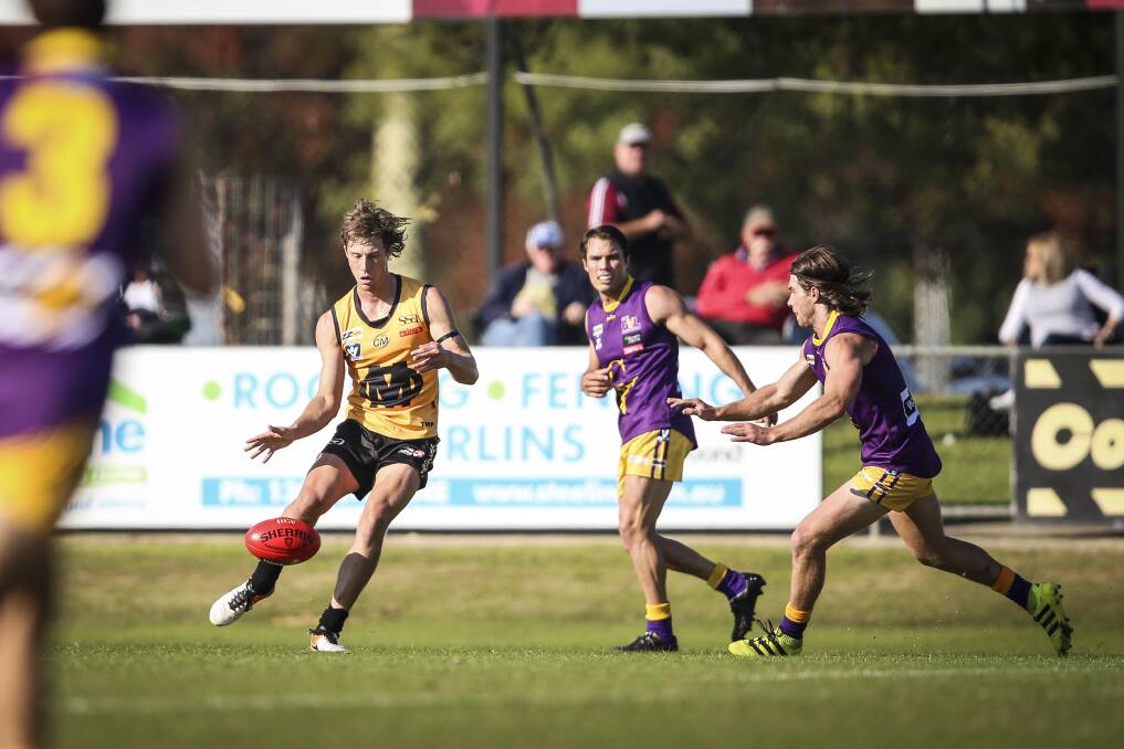 REPRESENTATIVE HONOURS: Yarrawonga coach Mark Whiley gets a kick away for Ovens and Murray against Goulburn Valley in 2017. The league have opted to postpone this year's clash until 2022. 