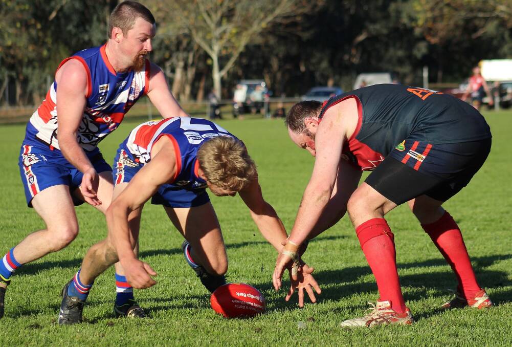 HARD AT IT: Bullioh co-coach Kelvin Wallace and Corryong's Evan Nicholas look to win the ball back for their sides on Saturday. Picture: DEB HARRAP