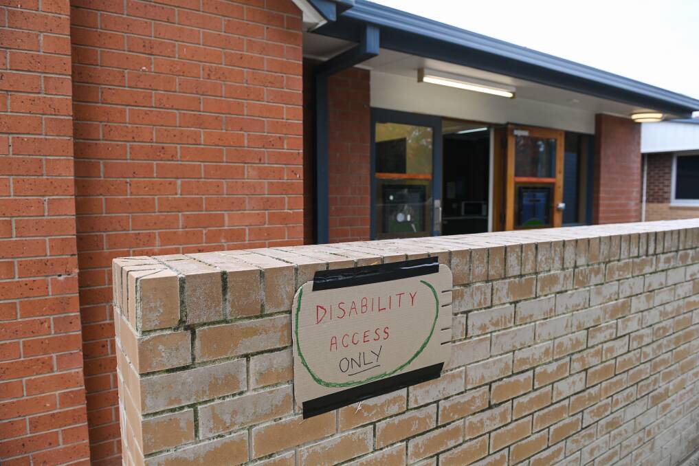 TEMPORARY: A makeshift sign on display to signal disability access at Wodonga's pre-poll voting site.
