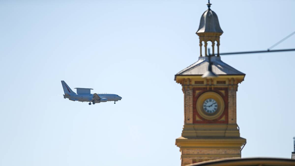 FLYING HIGH: An RAAF Boeing E-7A Wedgetail makes its way through the Albury on Monday. Picture: MARK JESSER