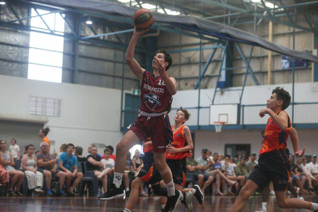 ALL THE WAY: Wodonga's Harry Stripeikis coasts into the basket for the Victorian Bushrangers' under-14s during day four action at the Australian Country Junior Basketball Cup. Picture: TARA TREWHELLA