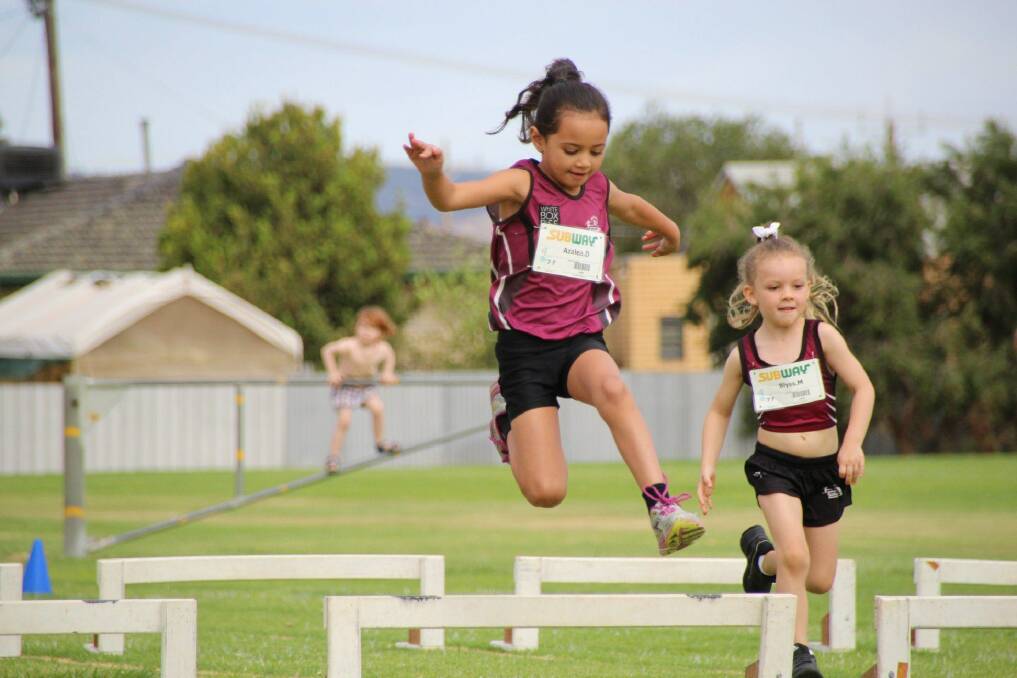 HURDLE CLEARED: Wodonga Little Athletics rising stars Azalea Dodd and Blyss Miller are looking forward to another big season. 