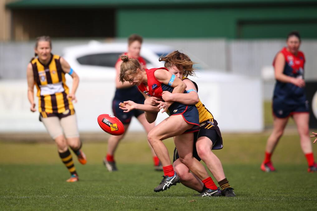 CRUNCH: Wodonga Raiders' Hannah Neumayer is caught in a tackle during her side's preliminary final victory against Wangaratta Rovers. Picture: JAMES WILTSHIRE