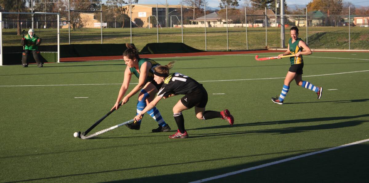 FIERCE BATTLE: Wombats-Beechworth's Mallory Campbell and Magpies' Nikita Nelson put in desperate efforts to win the ball back for their side. Picture: AMELIA BRITTEN

