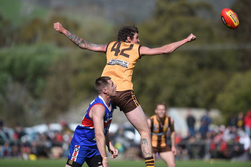 KSC's Tim Darcy and Thurgoona's Jamarl O'Sullivan compete in the ruck in last year's TDFL grand final. Taking the ball out of the ruck will not be considered prior opportunity this season.
