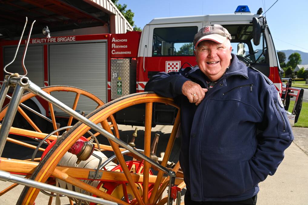 Mount Beauty CFA volunteer George Eldridge with the 1951 hose reel to be displayed as part of the brigade's 75th anniversary event. Picture by Mark Jesser