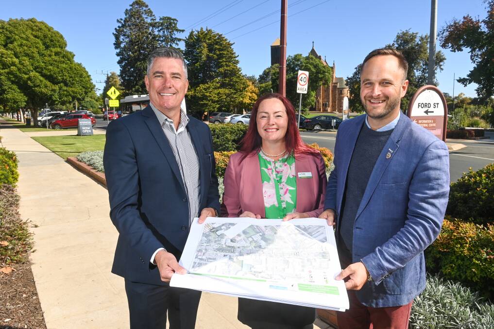 HAPPY: Wangaratta mayor Dean Rees shows his delight with Indi's Nationals and Liberal Party candidates Liz Fisher and Ross Lyman pledging funds to the city's CBD upgrade if the Coalition is re-elected. Picture: MARK JESSER