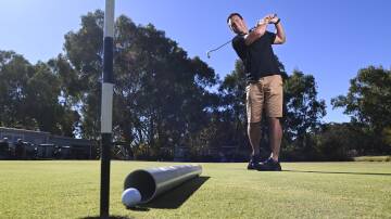 Border plumber Kade-Bell Chambers practices his swing ahead of a charity golf day at Thurgoona Country Club Resort on Friday, April 26, to support his Stars of the Border Dance for Cancer fundraising efforts. Picture by Mark Jesser