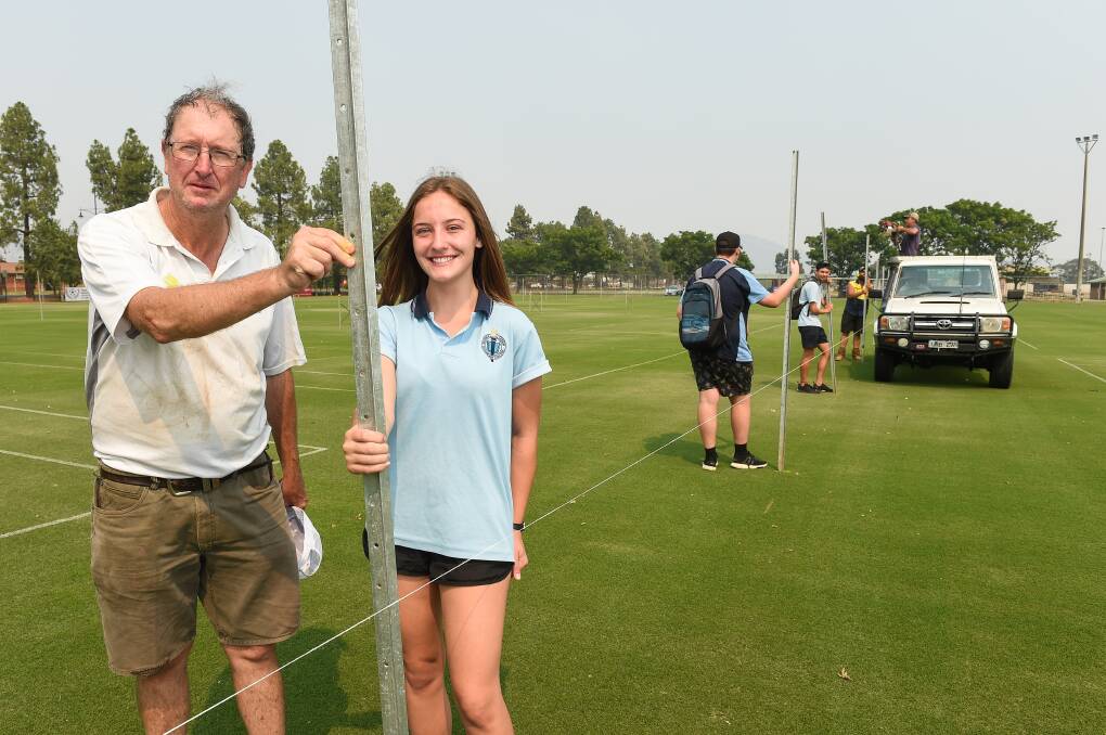 UPBEAT: Wodonga Tennis Centre vice-president Leigh Gadd with Wodonga Senior Secondary College student Teresa Marcuzzi preparing for Country Week earlier this year. The club is edging closer to a return to the court following positive news on the restrictions front this week.