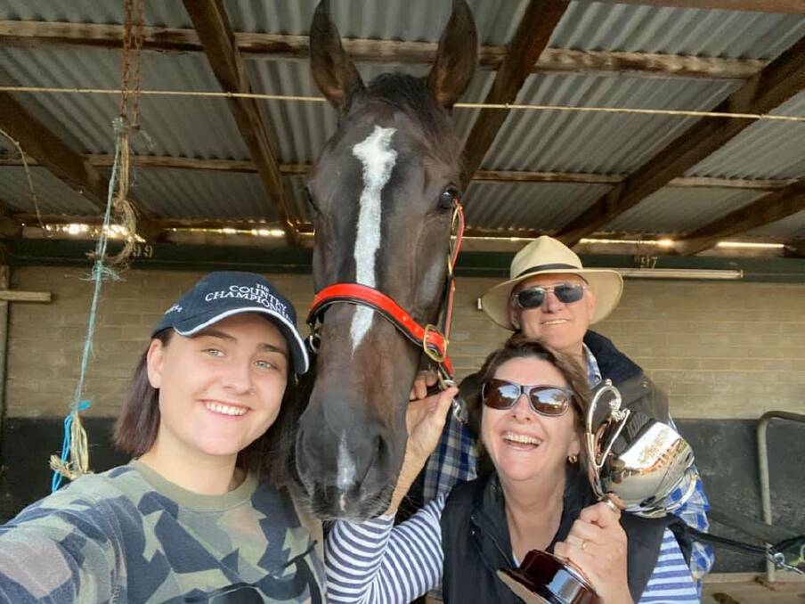 WINNERS ARE GRINNERS: Faith Collins, John Whitelaw and Vicki Whitelaw celebrate the Murrumbidgee Cup win of The Doctor's Son at Wagga on Sunday.