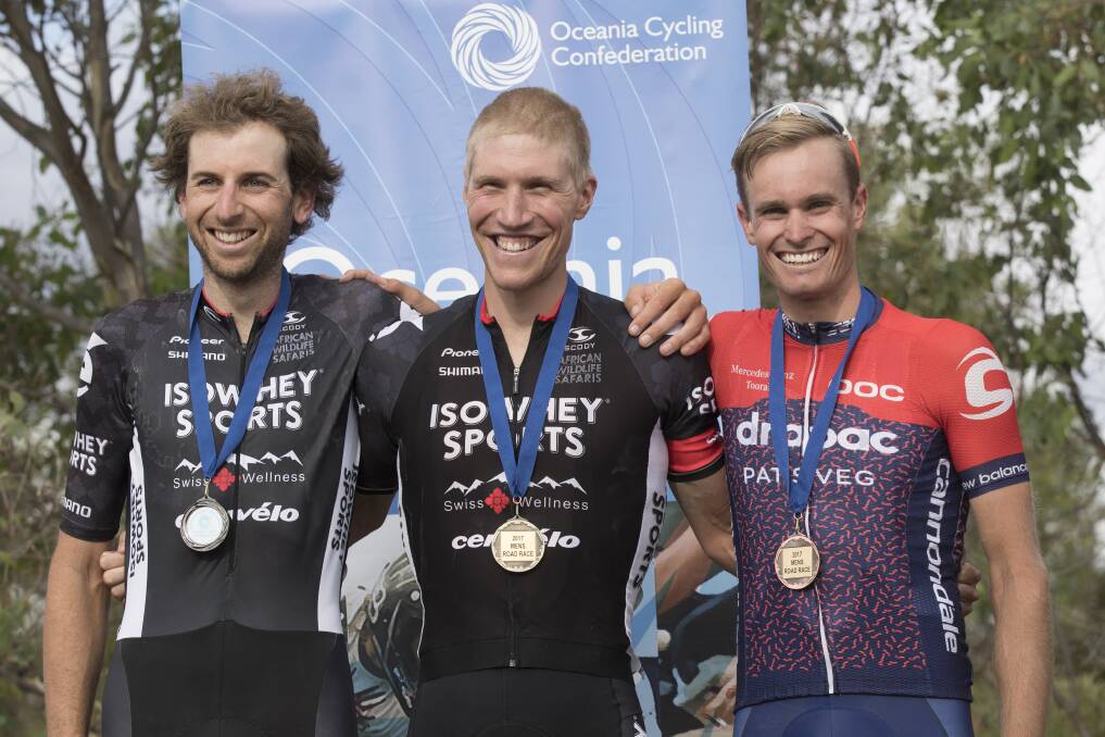 TRIPLE TREAT: Jesse Featonby celebrates 
his top three finish at the Oceania Road 
Championships alongside silver medalist 
Neil Van der Ploeg and champion Sean Lake. 
Picture: ADRIAN MARSHALL