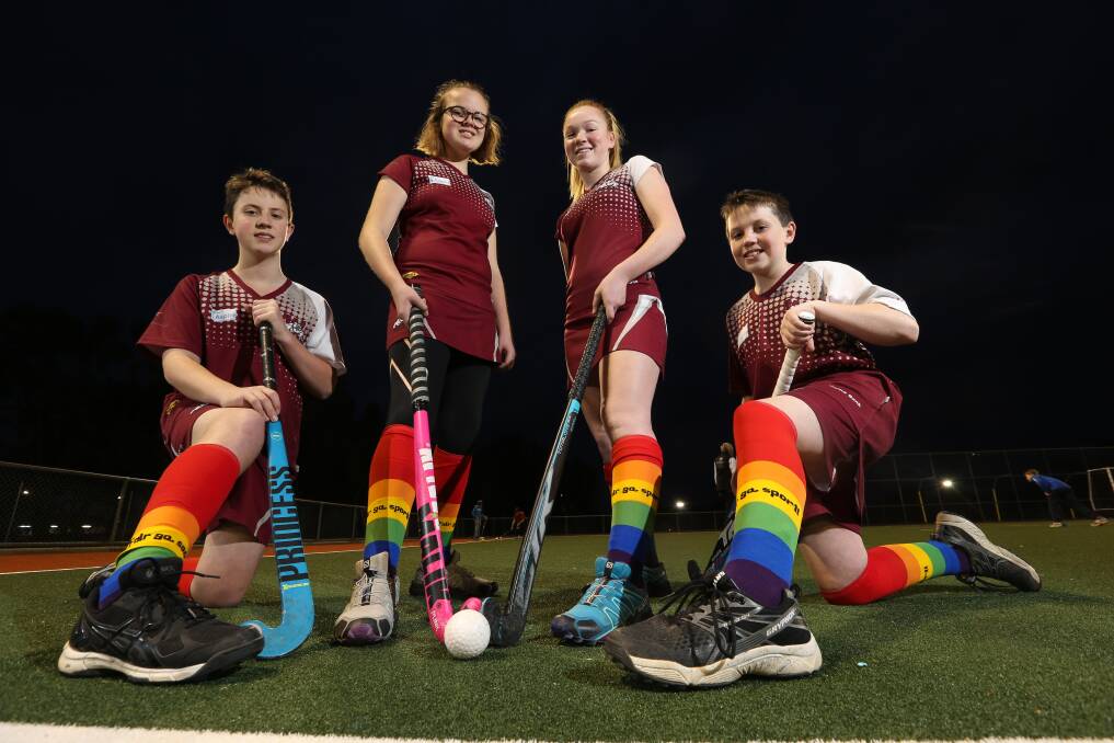 A COLOURFUL CAUSE: Wodonga Hockey Club's Patrick Bauerle, 13, Lucy Warhurst, 12, Rylee Pontt, 15, and Keaton Bauerle, 12, promoting Fair go, sport. Picture: KYLIE ESLER