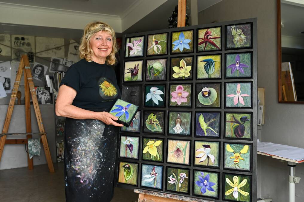 COLOURFUL: Stephanie Jakovac with her collage of Australian orchids to be exhibited in Canberra this week. Picture: MARK JESSER