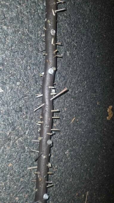An image posted to Facebook of the wooden pole covered with screws and nails that punctured a tyre on Captain Cook Drive in North Albury in the early hours of Saturday, March 2. Picture supplied