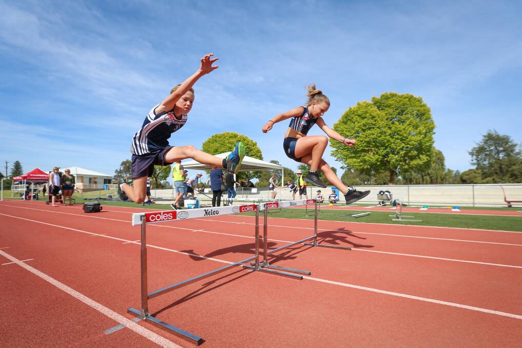 YOUNG GUNS: Jack Abbruzzese, 10, and Indi Van Ramselaar, 10, test out Albury Little Athletics Centre's brand new hurdles. Picture: JAMES WILTSHIRE