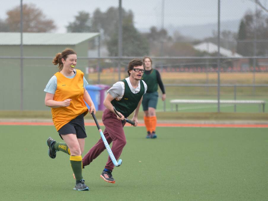 ALL SMILES: Wombats' Brydie Campbell takes on Norths' Isaac Simpson during Hockey Albury-Wodonga's eights round-robin last weekend. Picture: NARELLE HAMILTON