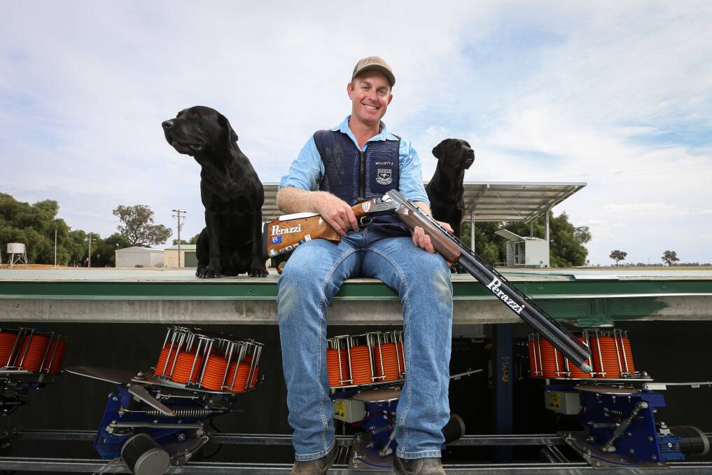 HOME SWEET HOME: Olympic shooter James Willett, with Thunder and Sam, is set to host the Australian Clay Target Association Riverina Zone Olympic Trap Championship at the family farm at Mulwala on Saturday. Picture: JAMES WILTSHIRE