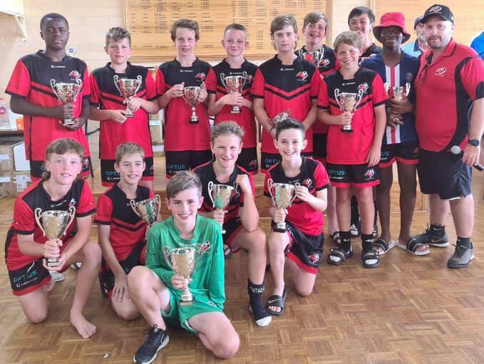 ALL SMILES: The Albury-Wodonga Football Association under-13 boys with their runners-up trophies from the Bathurst Cup. 