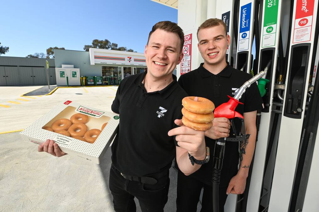 7-Eleven Australia field operations lead Alex Foley and store manager Peter Jones show off some of the offerings at Wodonga's new 7-Eleven service station on Melbourne Road. Picture by Mark Jesser
