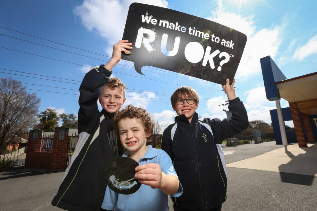 IMPORTANT QUESTION: St Augustine's Primary School students Dan Nelson, 9, Alby Palmer, 9, and Quinn Palmer, 6, are looking forward to Thursday's RU OK? Day activities. Picture: JAMES WILTSHIRE